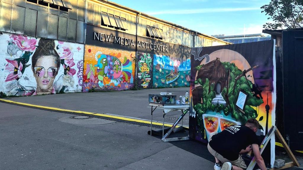 Street artist in action in Berlin RAW